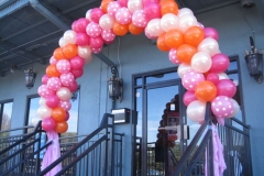Helium-filled-latex-balloon-arch-with-ribbon-streamers