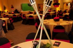 Bar-mitzvah-centerpiece-tiki-torches-ferns-balloon-flowers
