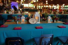 Camping-themed-mitzvah-table-scape-custom-table-numbers-lanterns