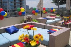 Rooftop-birthday-party-balloon-clusters-floral-centerpiece-sunflowers