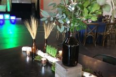 Rustic-tablescape-greenery-birch-branches-brown-glass-bottle-wheat