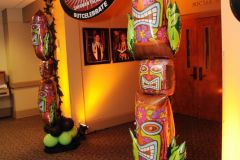 Tiki-themed-entrance-decor-balloon-column-custom-sign