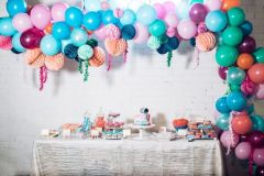 Birthday-party-candy-table-organic-balloon-garland-with-paper-lanterns
