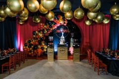 ESPYs-themed-bar-mitzvah-organic-garland-backdrop-gold-orbz-ceiling-decor