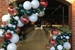 Organic-entrance-piece-with-confetti-balloon-and-greenery