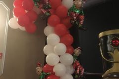 Holiday-party-candy-cane-balloon-sculpture-with-elf-balloons
