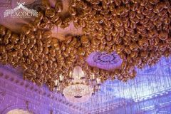 Wedding-reception-helium-filled-gold-balloons-with-very-long-ribbon
