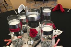 Casino-themed-centerpiece-glass-cylinder-floating-candles