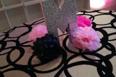 Monogram-style-glitter-letter-with-poof-balls