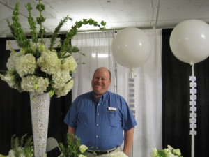 Sean Muscio of Balloonacy in Atlanta, with flowers and balloons.